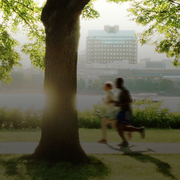 Banner image of couple jogging through the park.