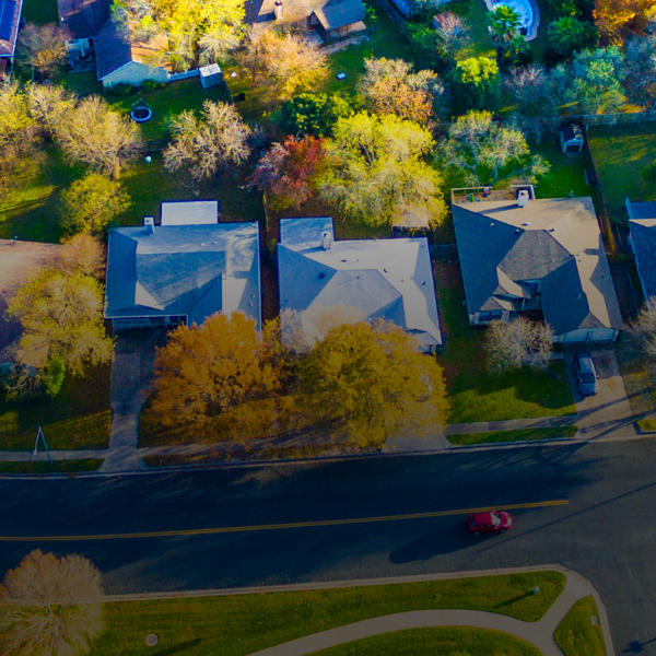 Banner image of an aerial view of houses in a neighborhood.